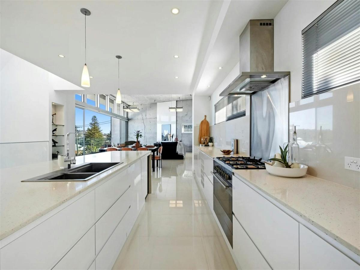 A massive, slick galley kitchen makes it easy to cook for the whole tribe