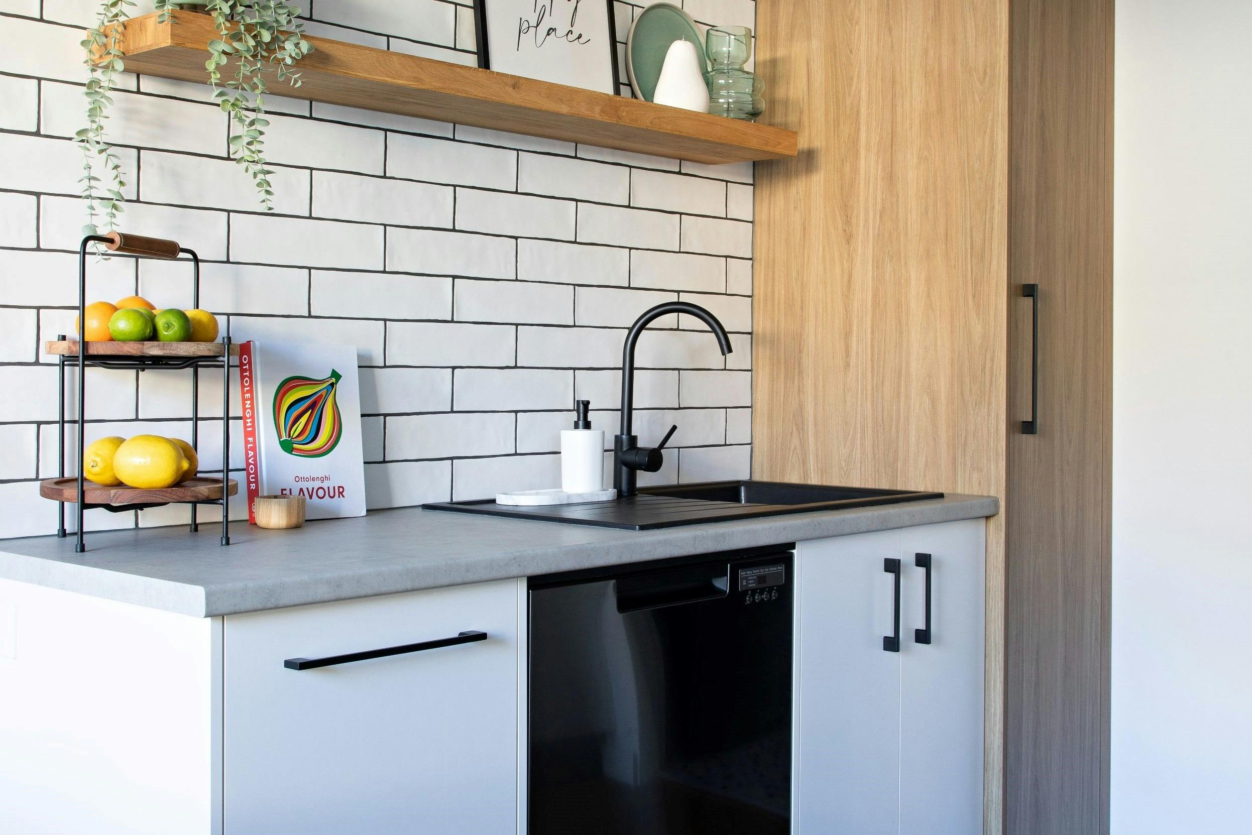 Kitchen with full sized oven, cooktop, microwave and dishwasher and double door fridge freezer
