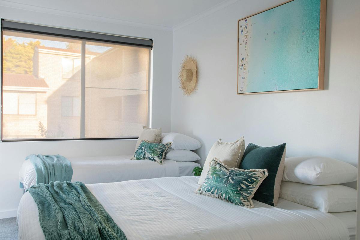 Sleep well in the second bedroom with queen bed, single bed and trundle