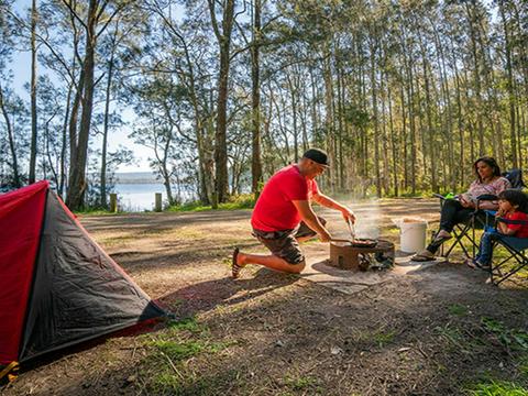Campers cooking up a storm at Bungarie Bay campground. Photo: John Spencer/OEH