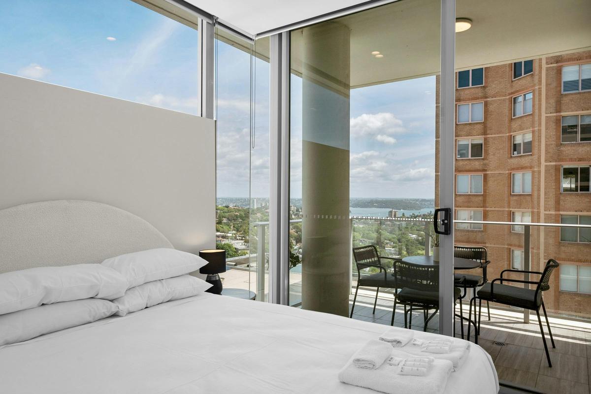 Relax in style with stunning views from this modern bedroom.