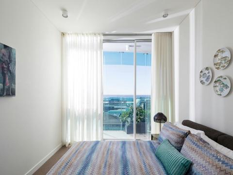 Light filled bedroom with access to the balcony