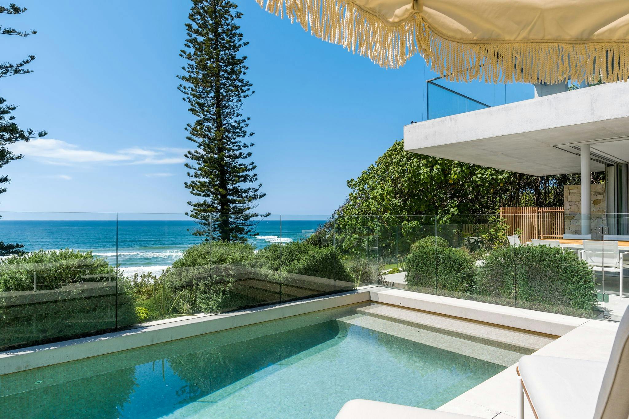 Oceanview swimming pool and covered patios create a private oasis for sunbathing and dining