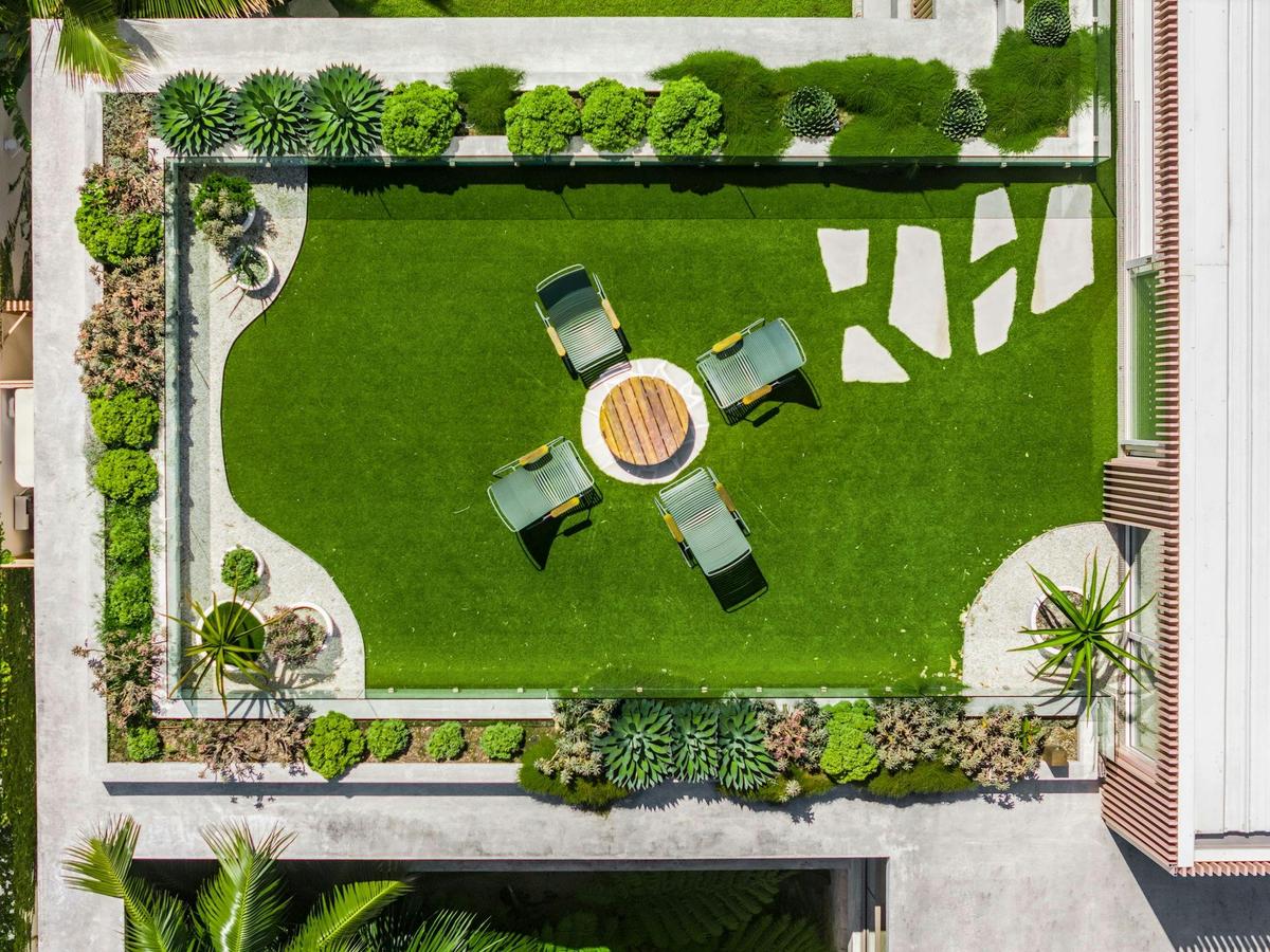Landscaped garden and expansive balconies offer serene outdoor spaces to relax and enjoy the views