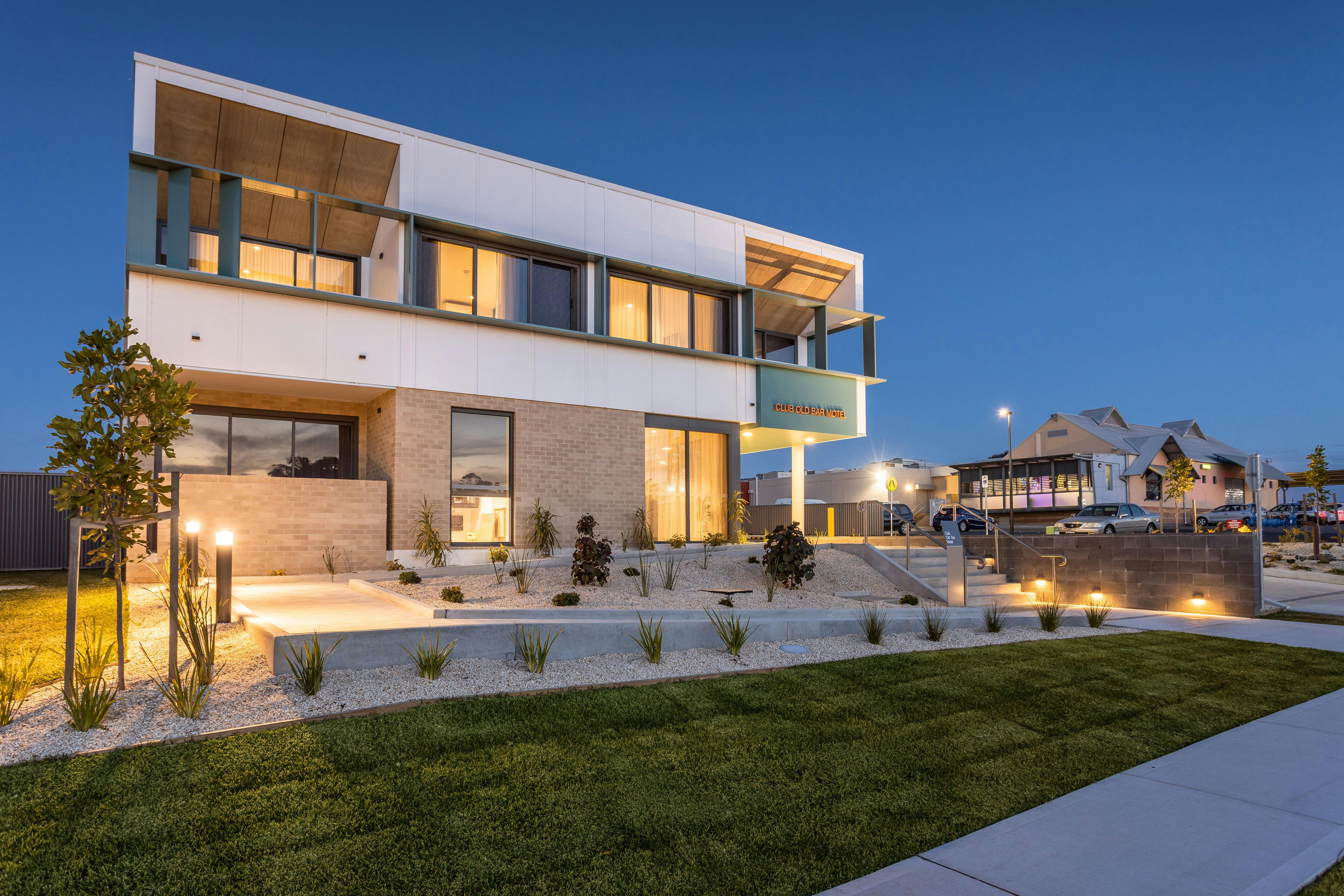 Cub Old Bar Motel at Night with Club Old Bar in the Background