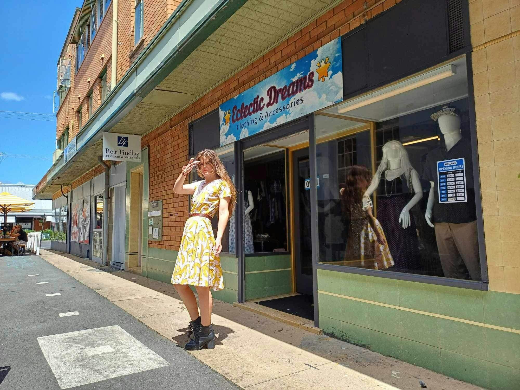 Model out the front of the store in beautiful dress