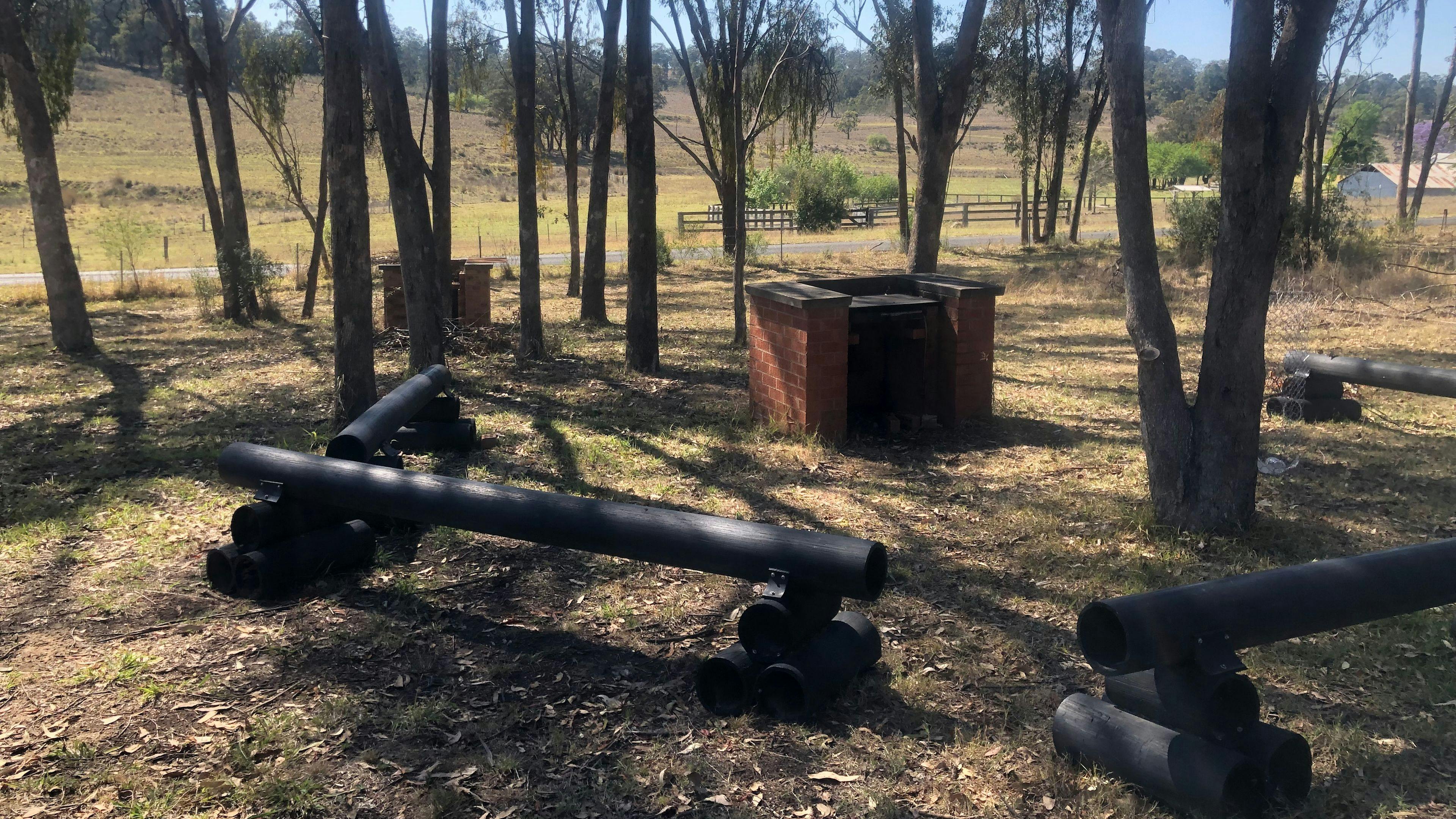 BBQ free to use
Bench seating under shady trees 
