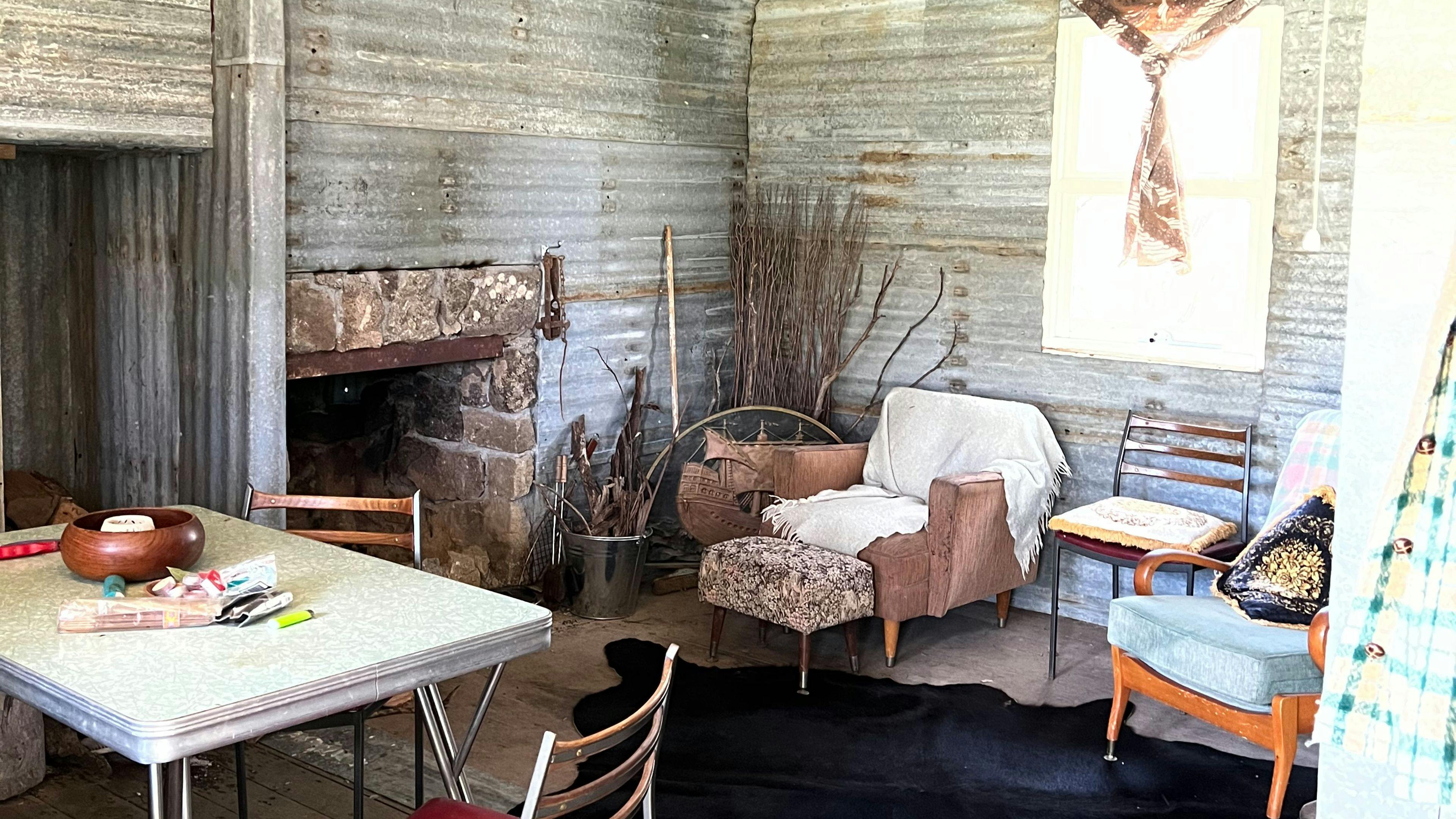Living area with open fire place.