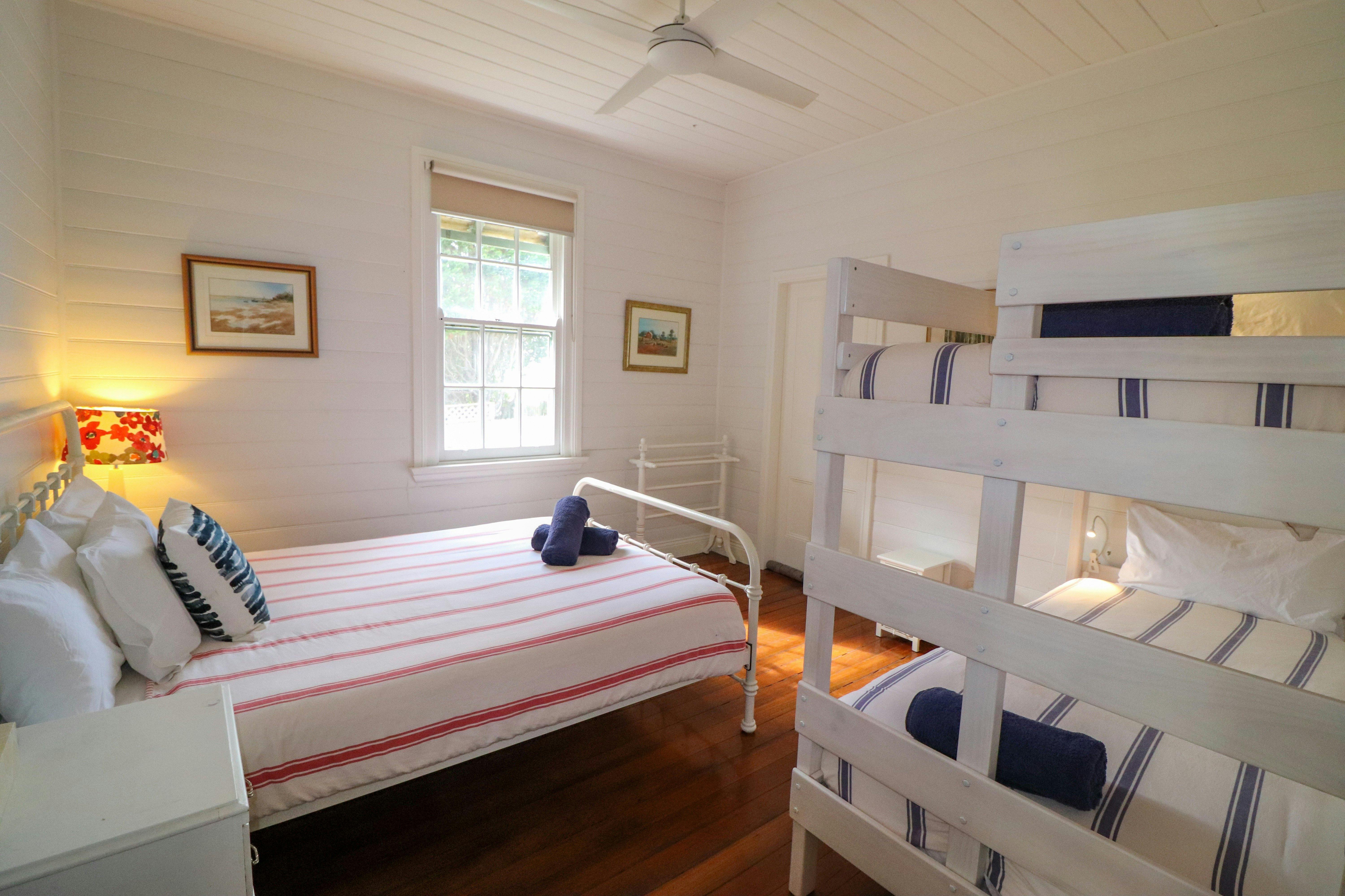 Bedroom with queen bed and bunk bed