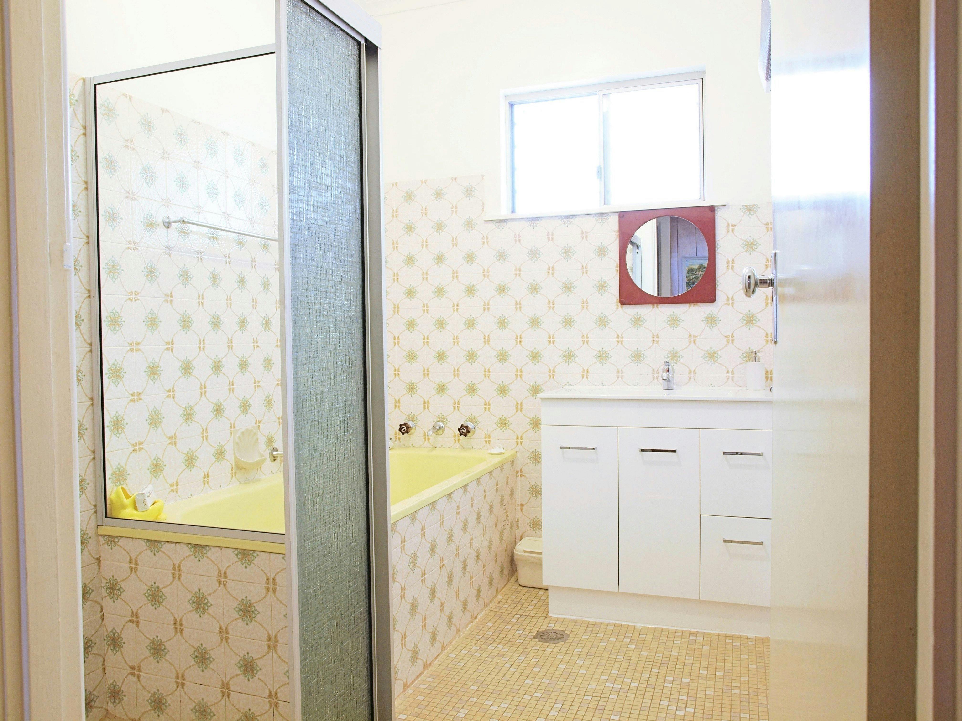 Separate shower with mobility rails & full size bath