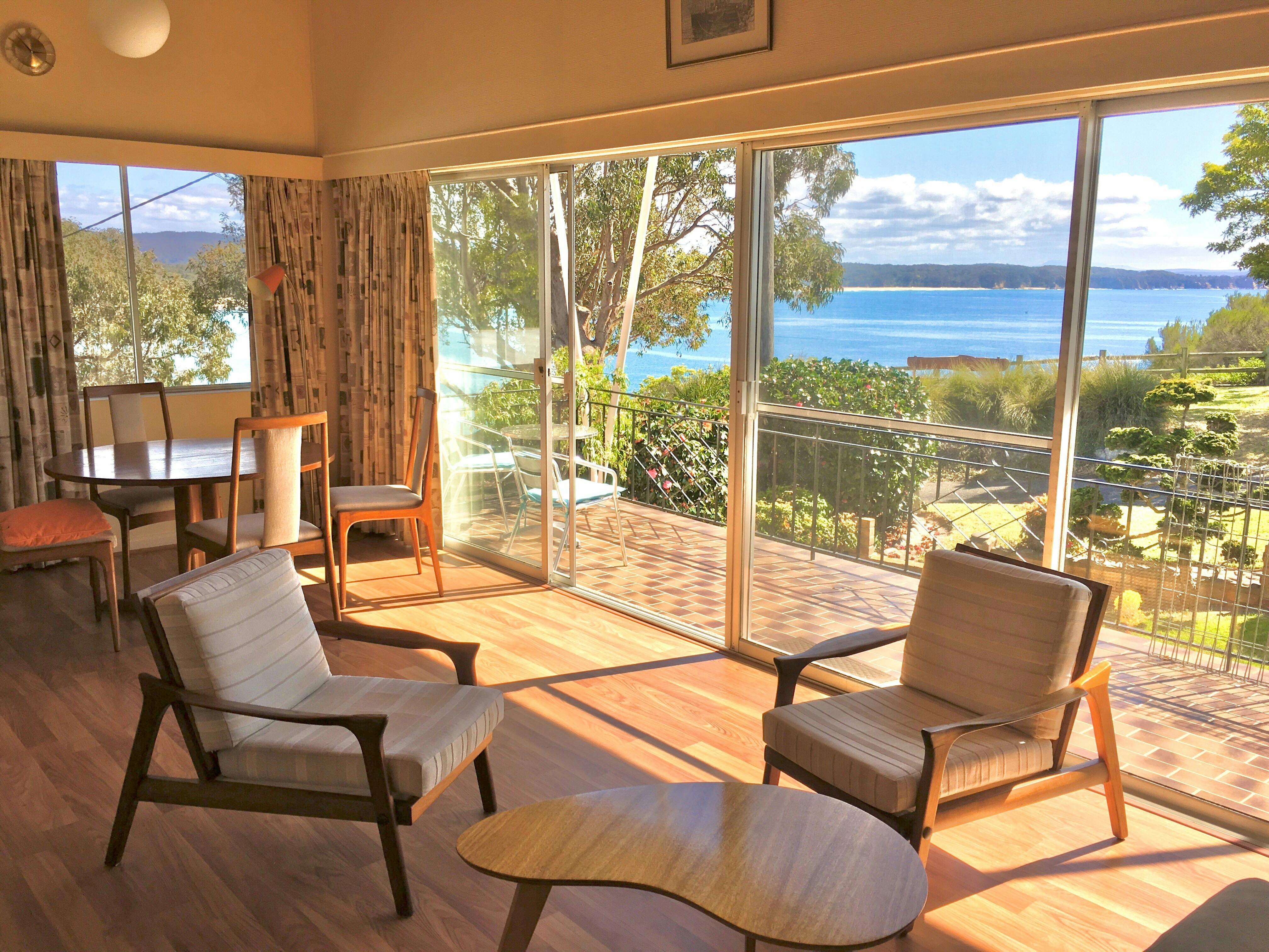 Sunny lounge room with spectacular ocean view