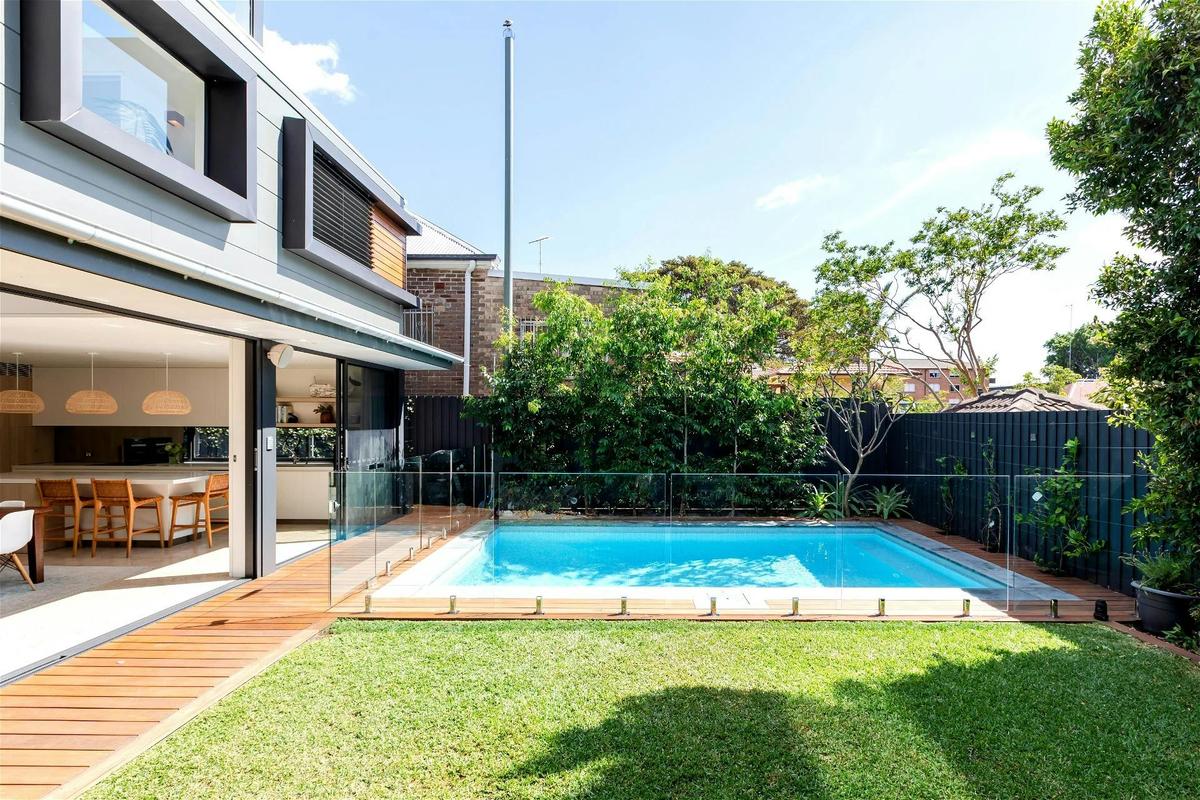 large glass sliding doors and tranquil views of the pool encourage a slower-paced lifestyle