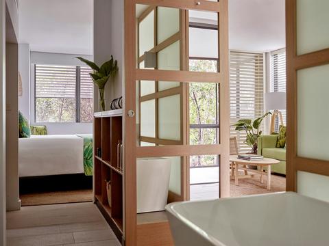 Rainforest luxe suite bed and bath
