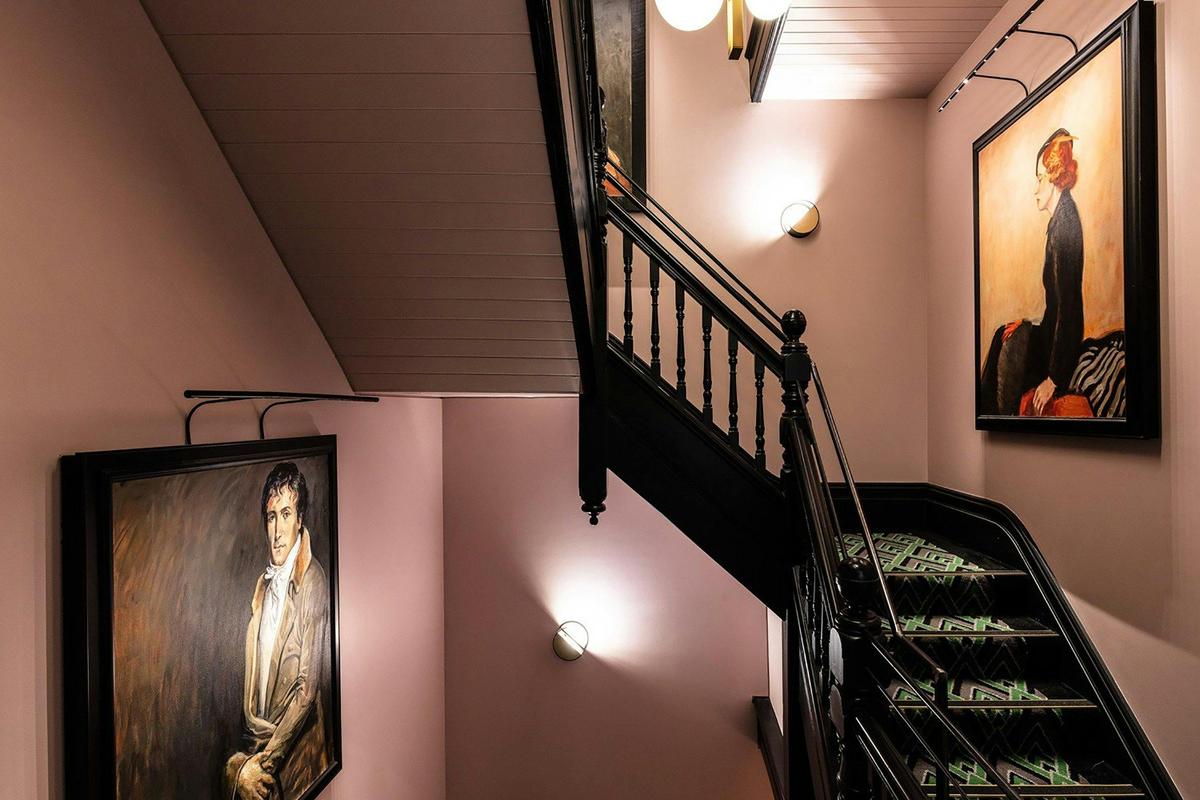 Crystalbrook Albion staircase and portraits by acclaimed Australian artist Ann Cape