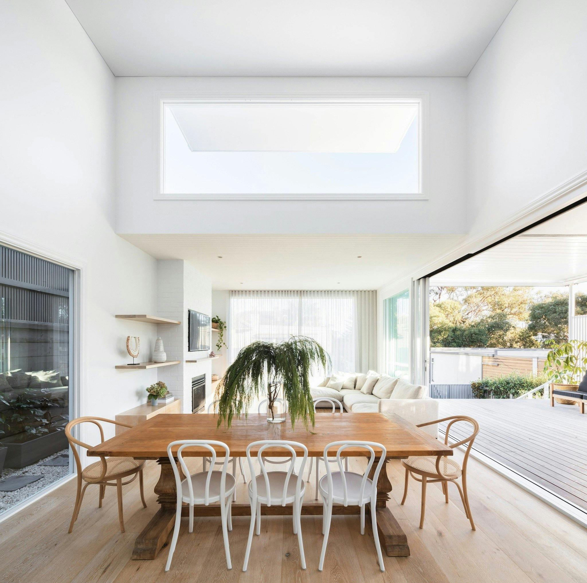 The light filled dining area with timber table
