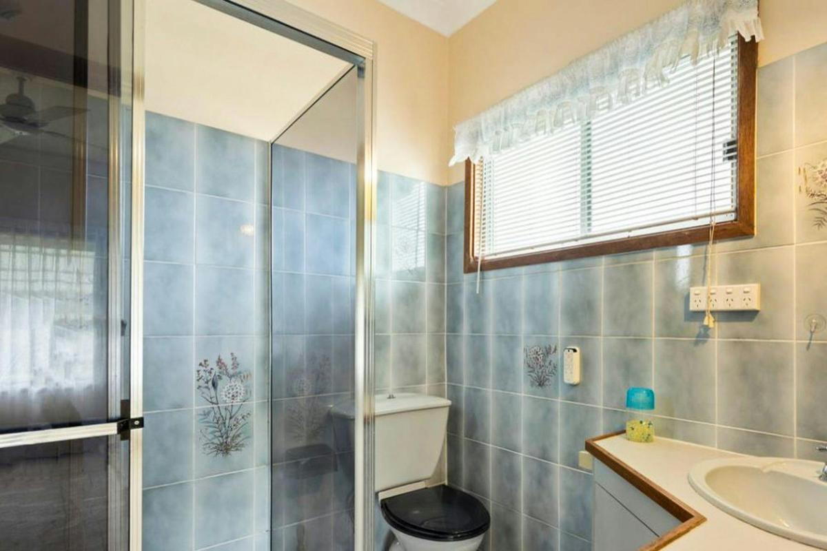 Ensuite bathroom with shower and toilet