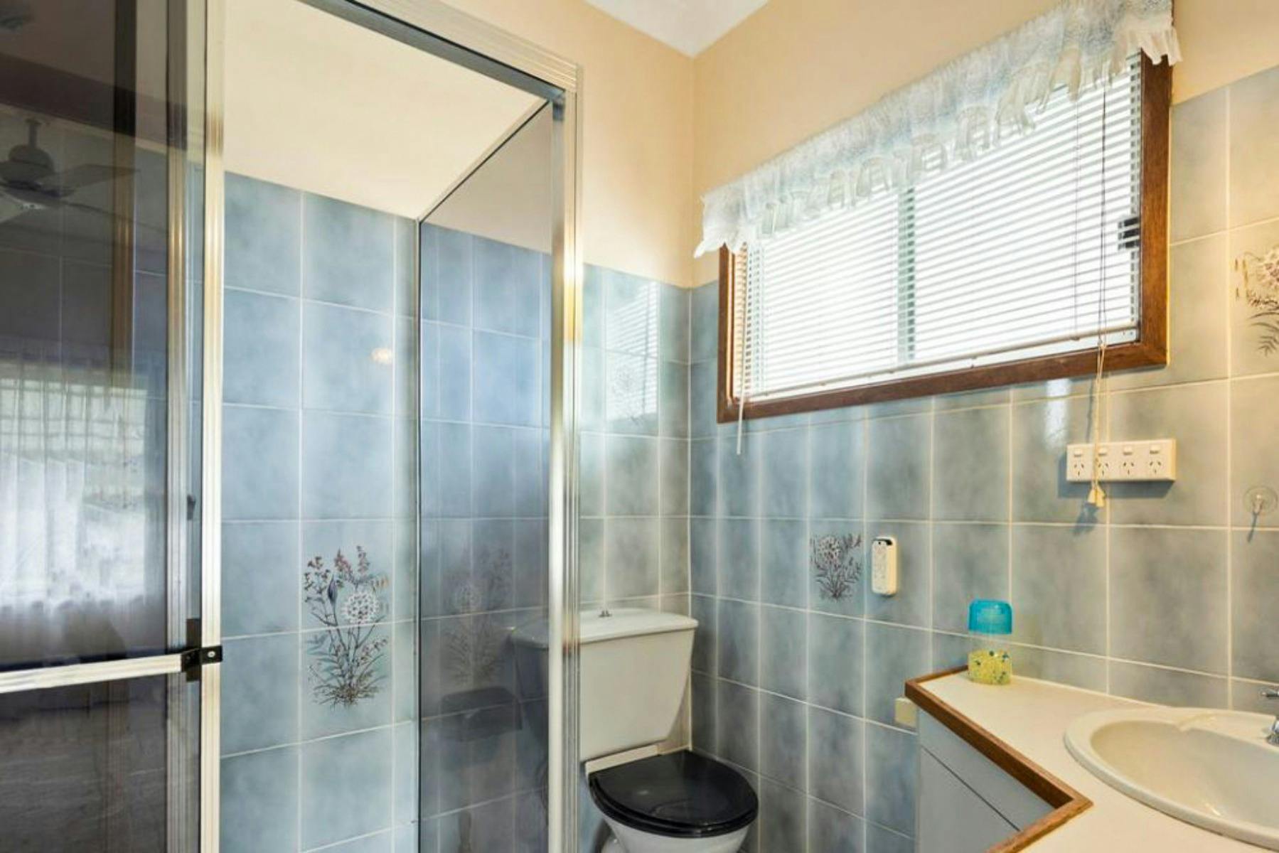 Ensuite bathroom with shower and toilet