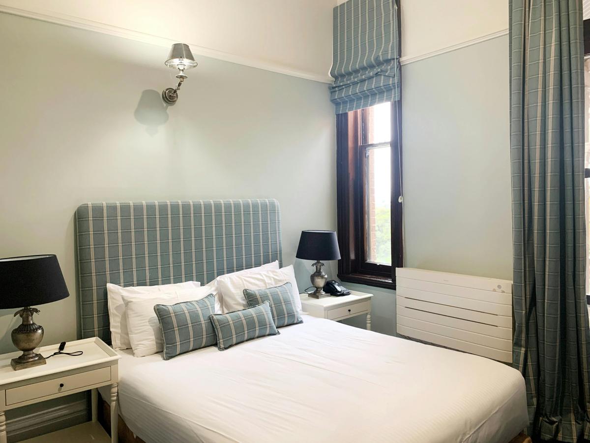 A shot showing the bed and bedside tables