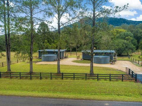 View of property from the roadway. In shot are both cottages as they sit on the land