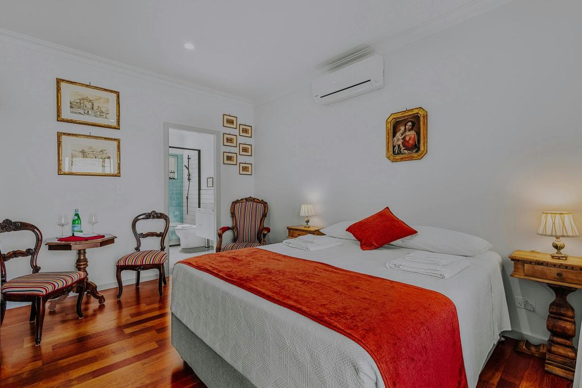 Accommodation option The Classic, room with queen size bed and classic Italian furniture