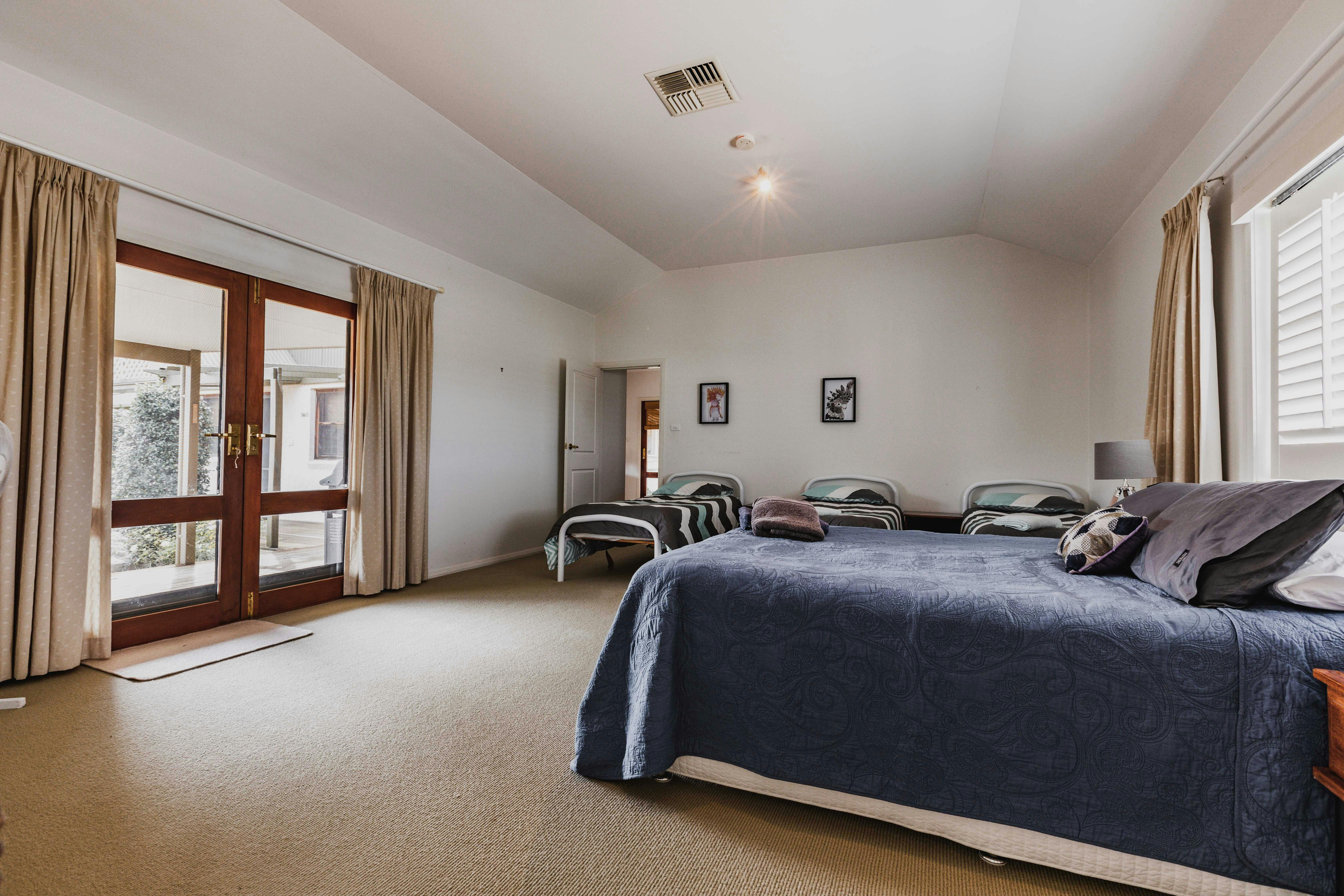 Family Suite fitted with a Queen Bed and 3 Singles