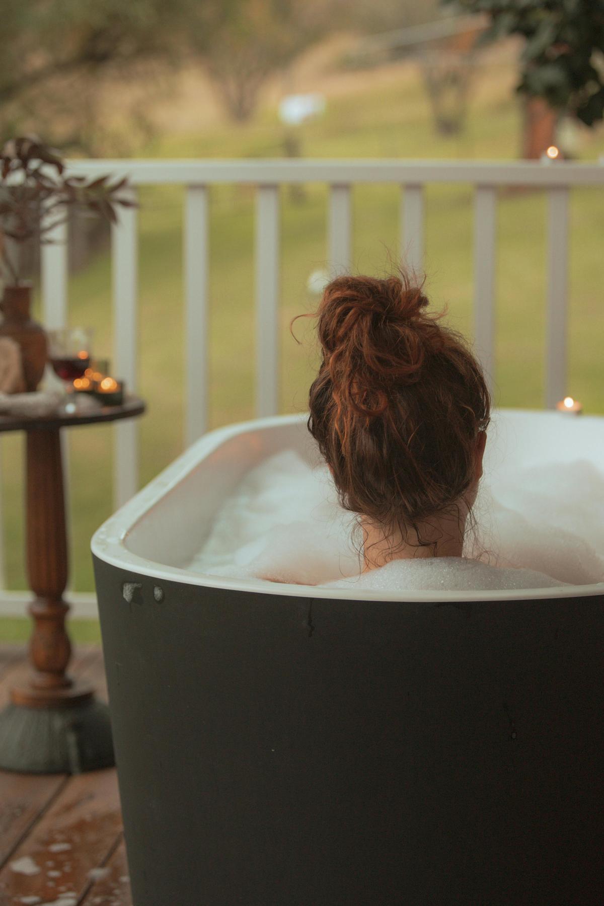 Outdoor bathing on the verandah with views to the fields