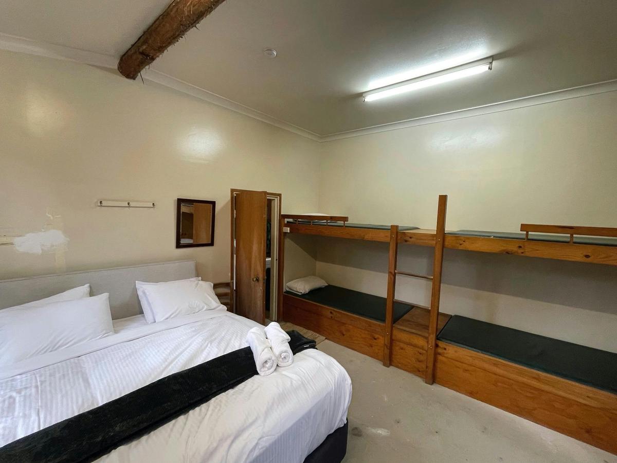 Bedroom with king and 4 bunkbeds