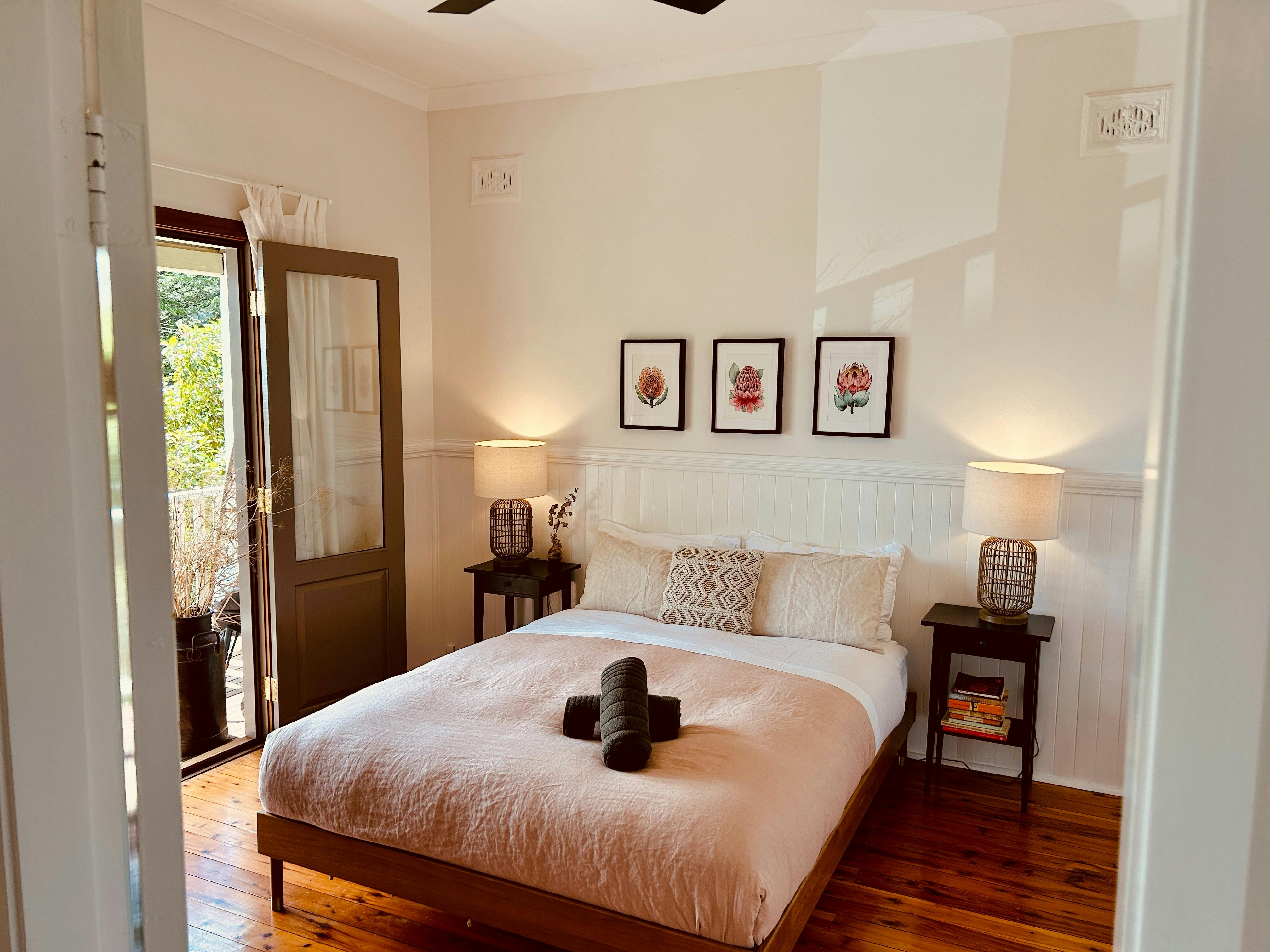 The main bedroom is awash in natural sunlight, creating a soothing and tranquil atmosphere.