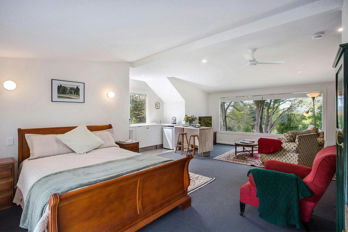 Spacious, comfortable bed and lounge area