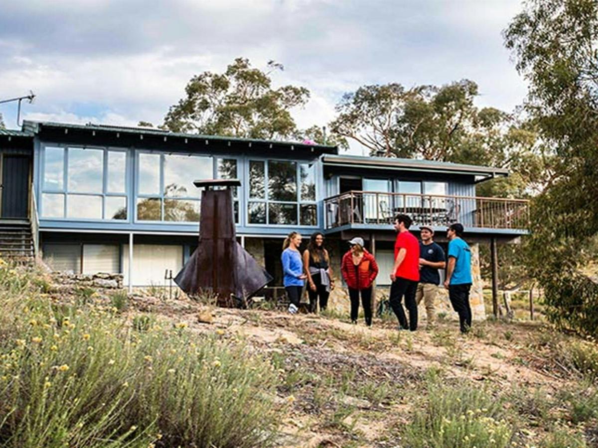 A group of friends outside Creel Lodge, Kosciuszko National Park. Photo: Boen Ferguson/OEH.