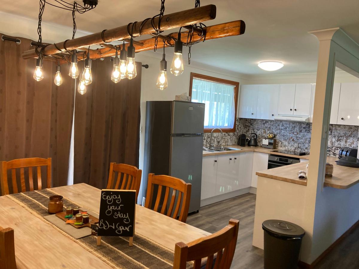 sojourn open plan kitchen, dining and breakfast bench  perfect for sharing a story, meal or beverage