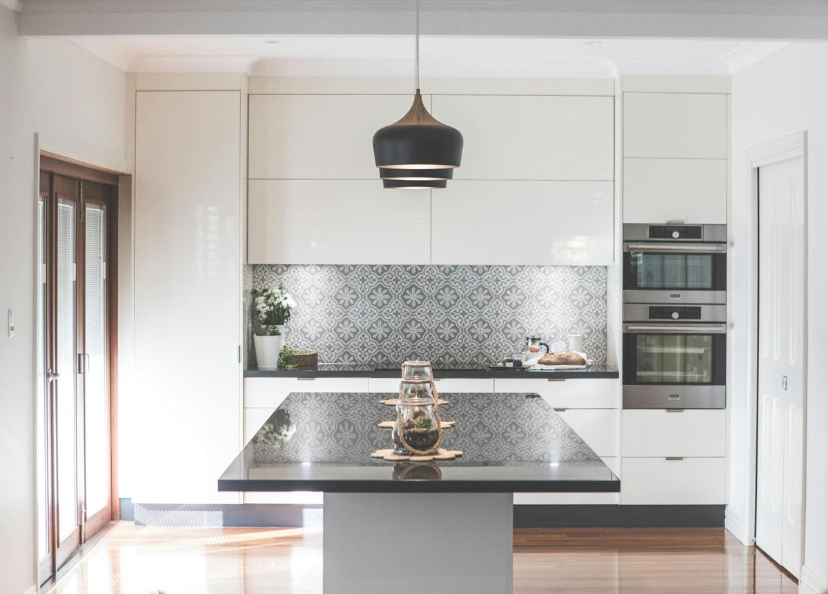 The kitchen area includes butlers pantry to the right and bi fold opening doors to garden area.
