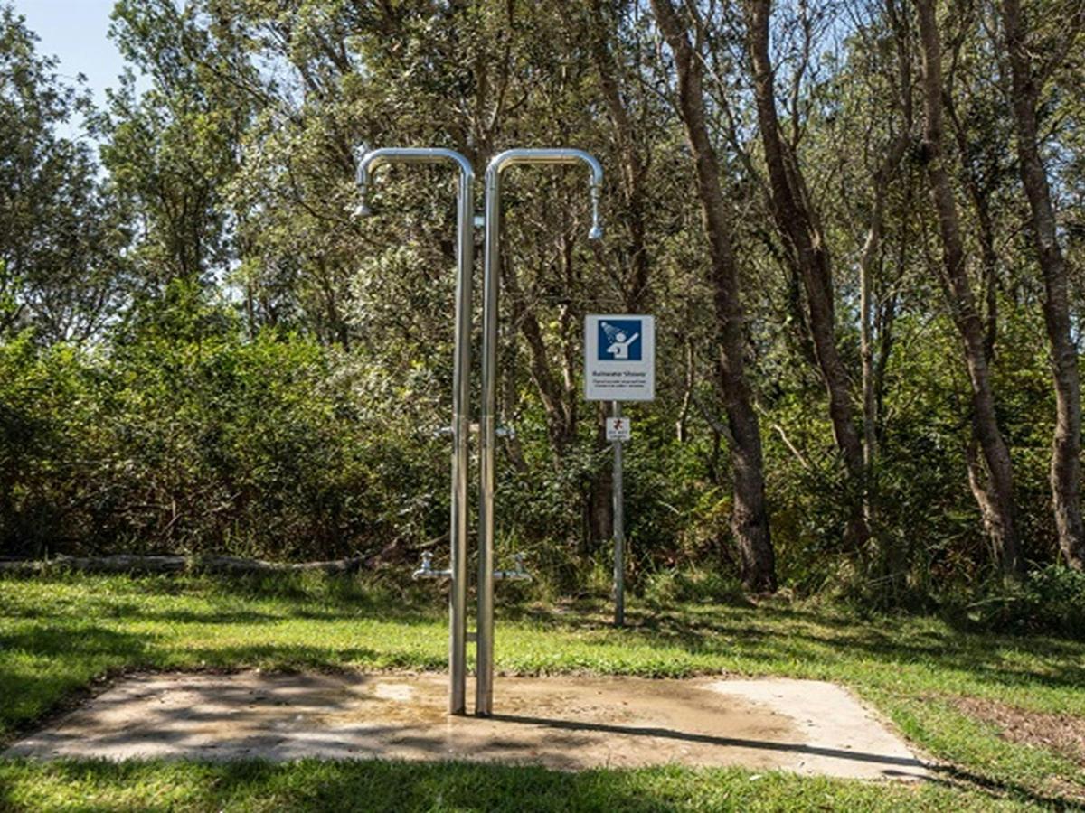 Outdoor rainwater shower at Crowdy Gap campground, Crowdy Bay National Park. Photo: Rob Mulally/DPIE