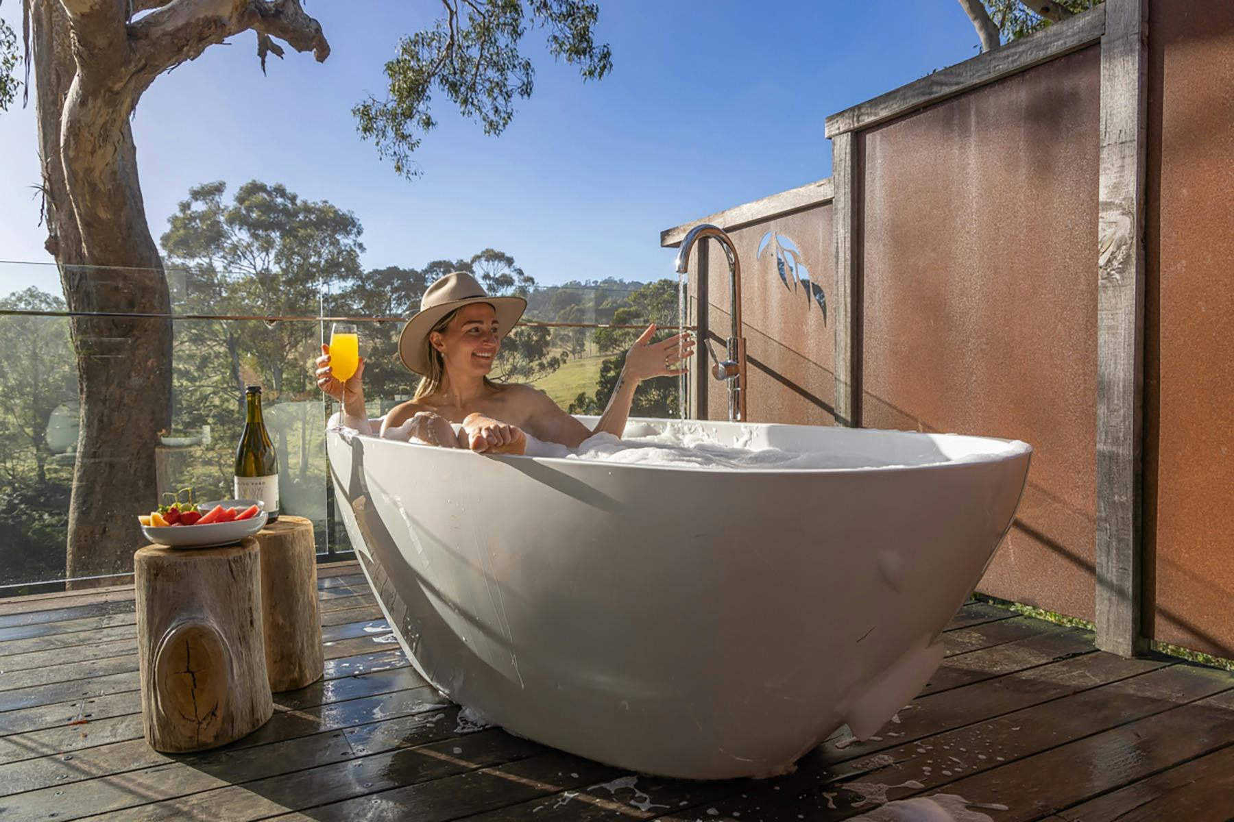 Private outdoor bath with views of river and countryside
