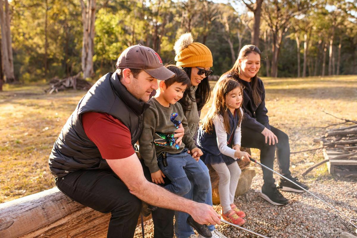 Roasting marshmallows over the campfire.