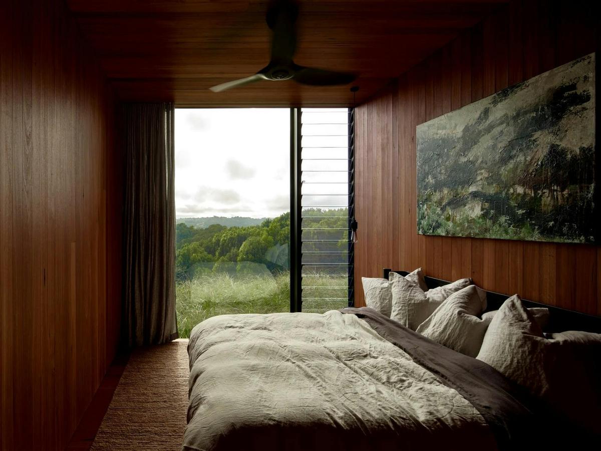 Master suite featuring an ensuite with a bathtub, a large walk-in robe and private deck with views