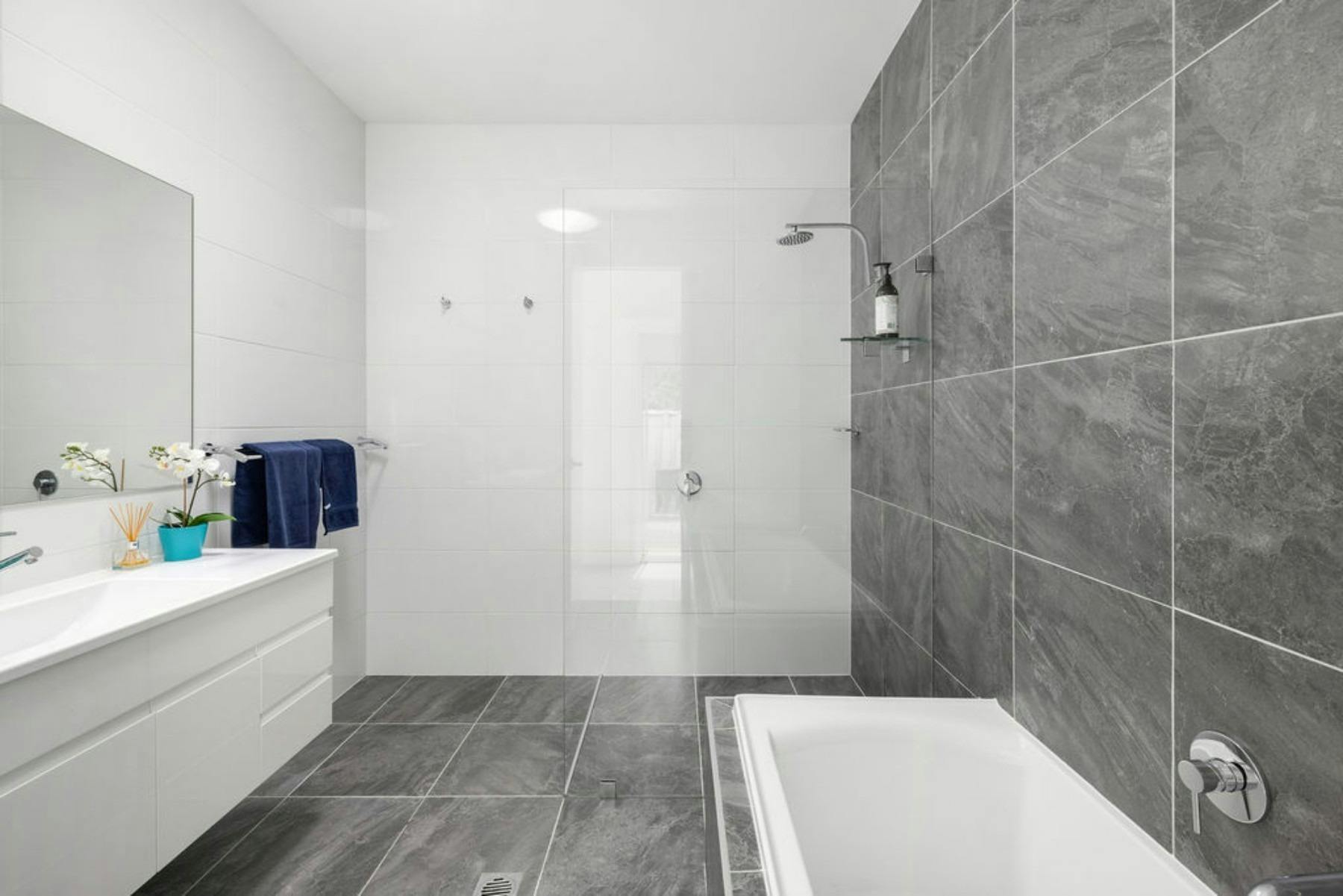 Family bathroom with walk-in shower and full size bath tub