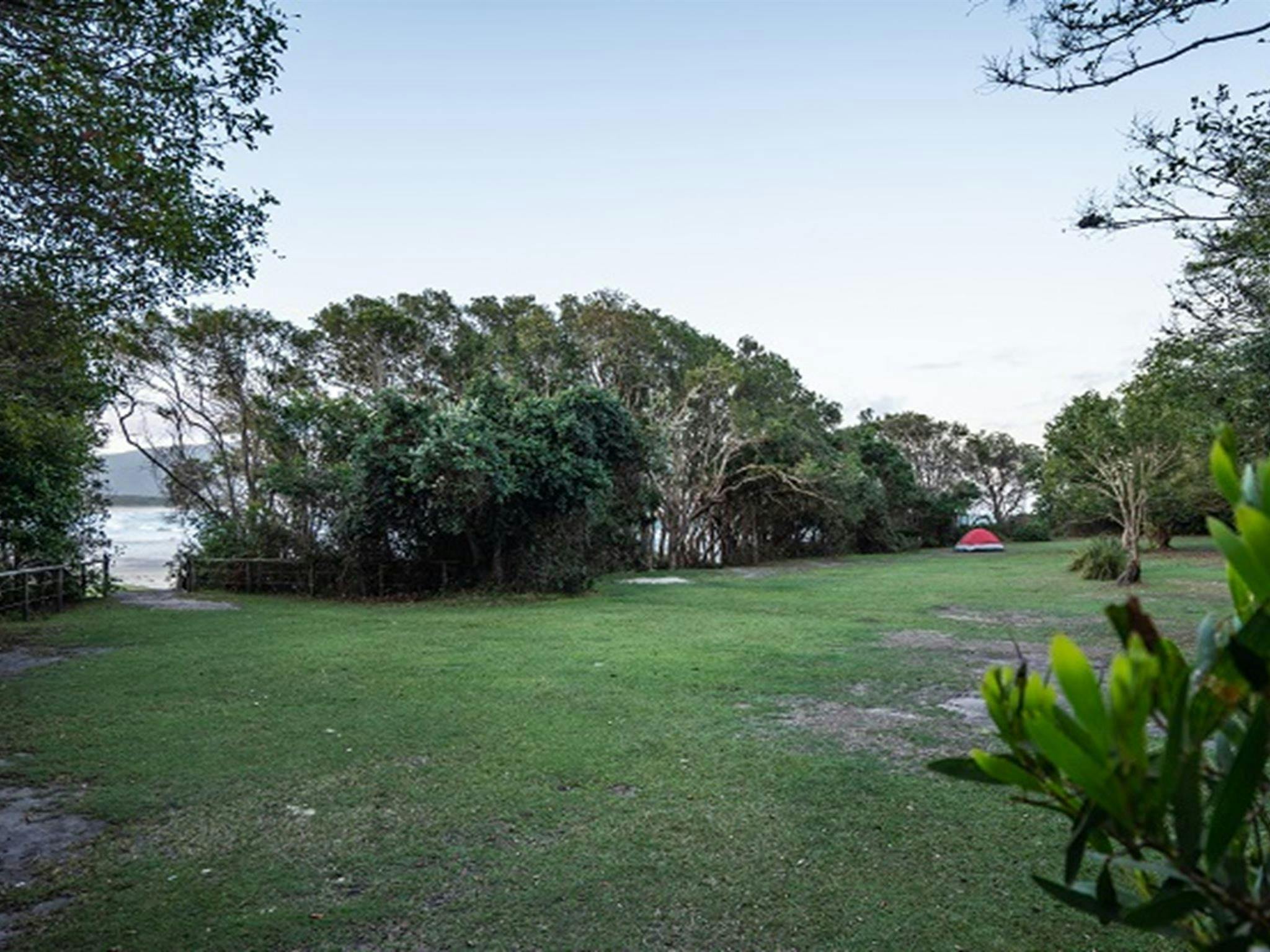 A tent pitched near the pathway to Dungoban Beach at Diamond Head campground, Crowdy Bay National