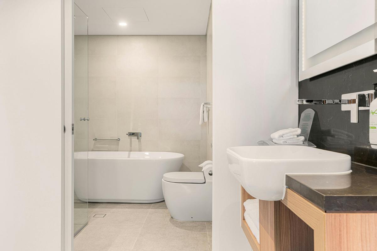 1 King Bed 1 Bedroom Suite spacious bathroom with bathtub