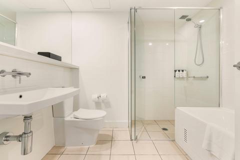 Guest bathroom with both shower and a comfy bathtub