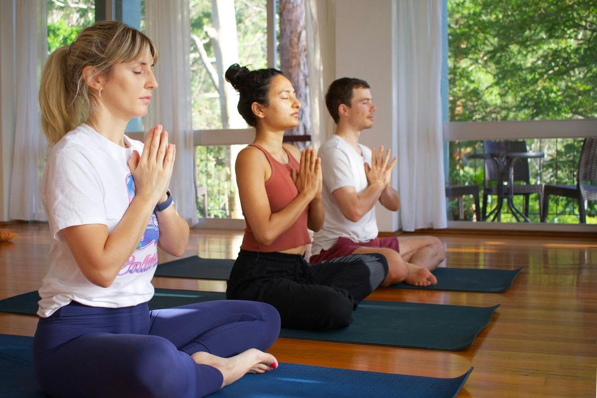 3 Students doing Yoga