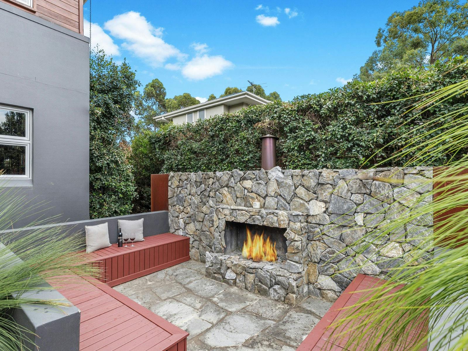 Fernweh outdoor fireplace and entertainment area