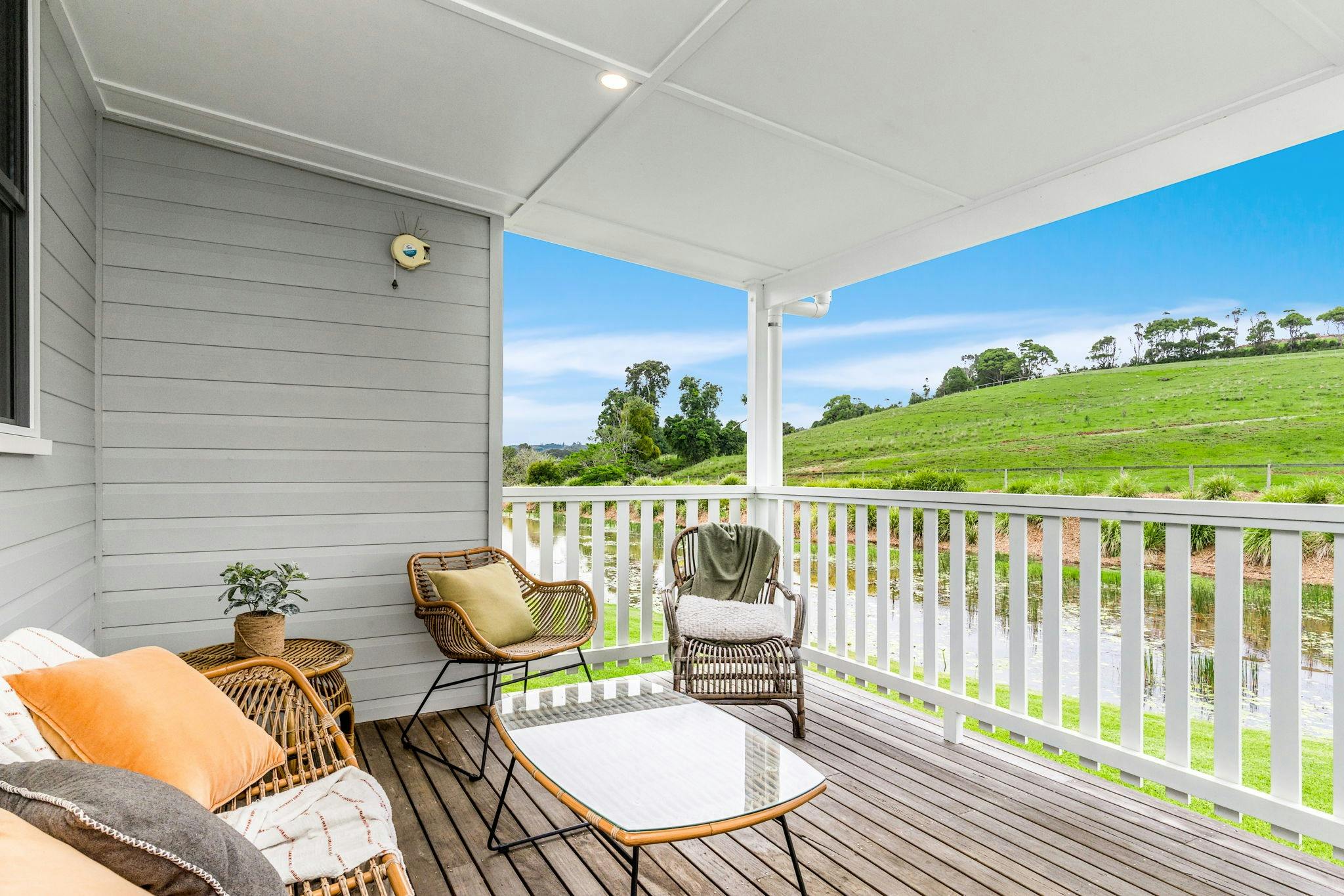 Large verandahs overlooking water and Farmland. Outside dining and cane furniture and BBQ