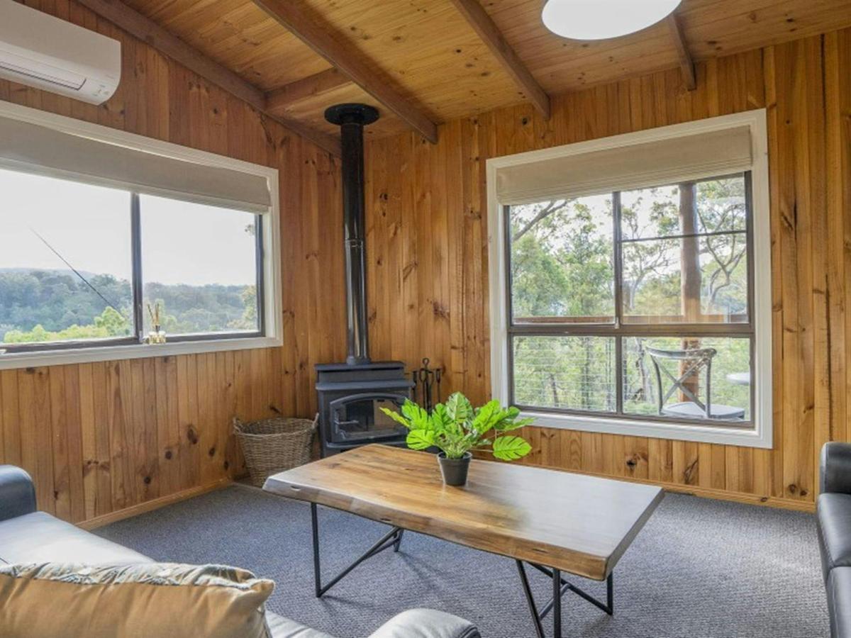 The lounge room in Galong cabins with fireplace and reverse-cycle air conditioning. Photo: Simone