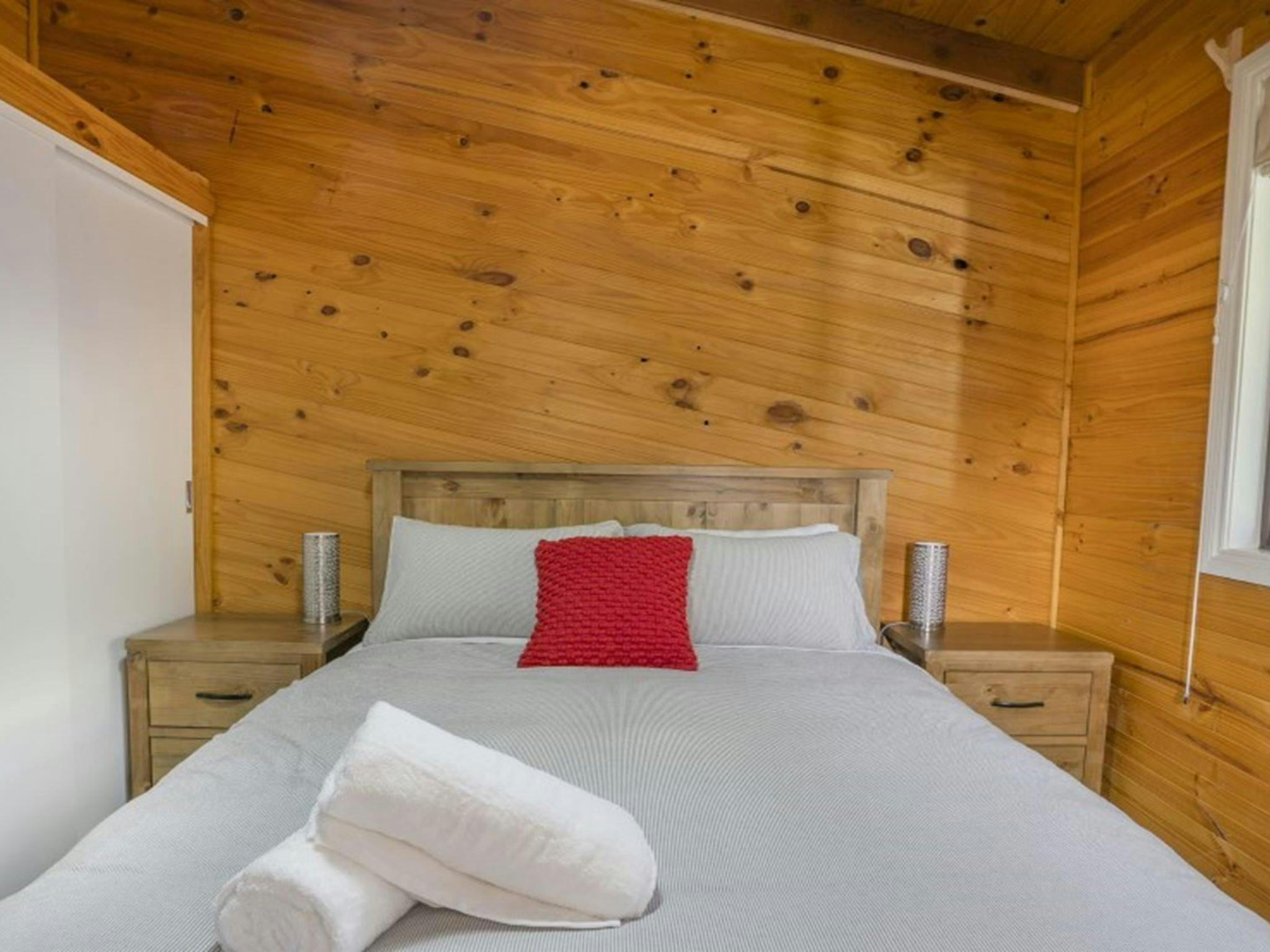 A bedroom with queen bed in Galong cabins, Blue Mountains National Park. Photo: Simone Cottrell