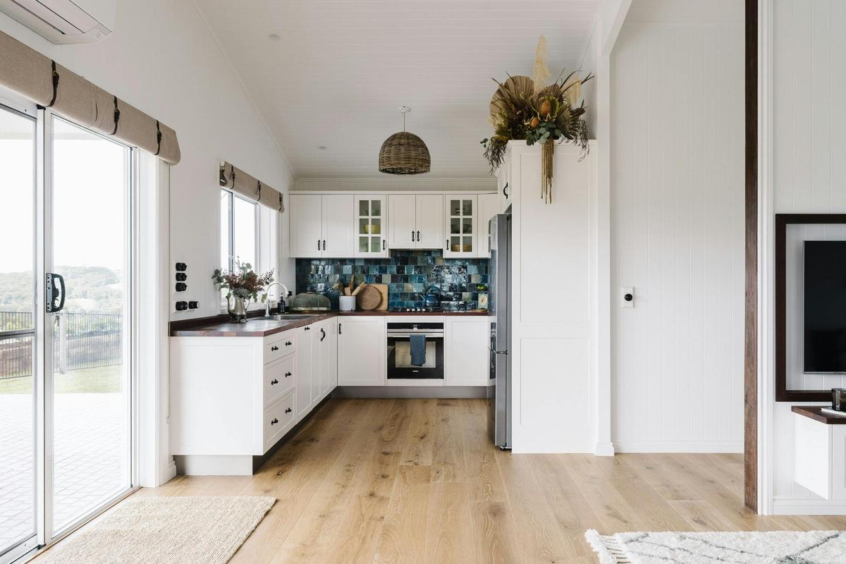 Kitchen with handcrafted reclaimed timber benchtops and Jatana tiles splashback