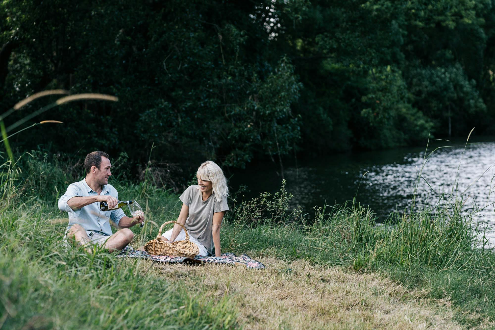 Picnic on the banks of the Wilson River on a Wandering Folk picnic rug