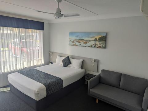 Queen motel room bed and sofa