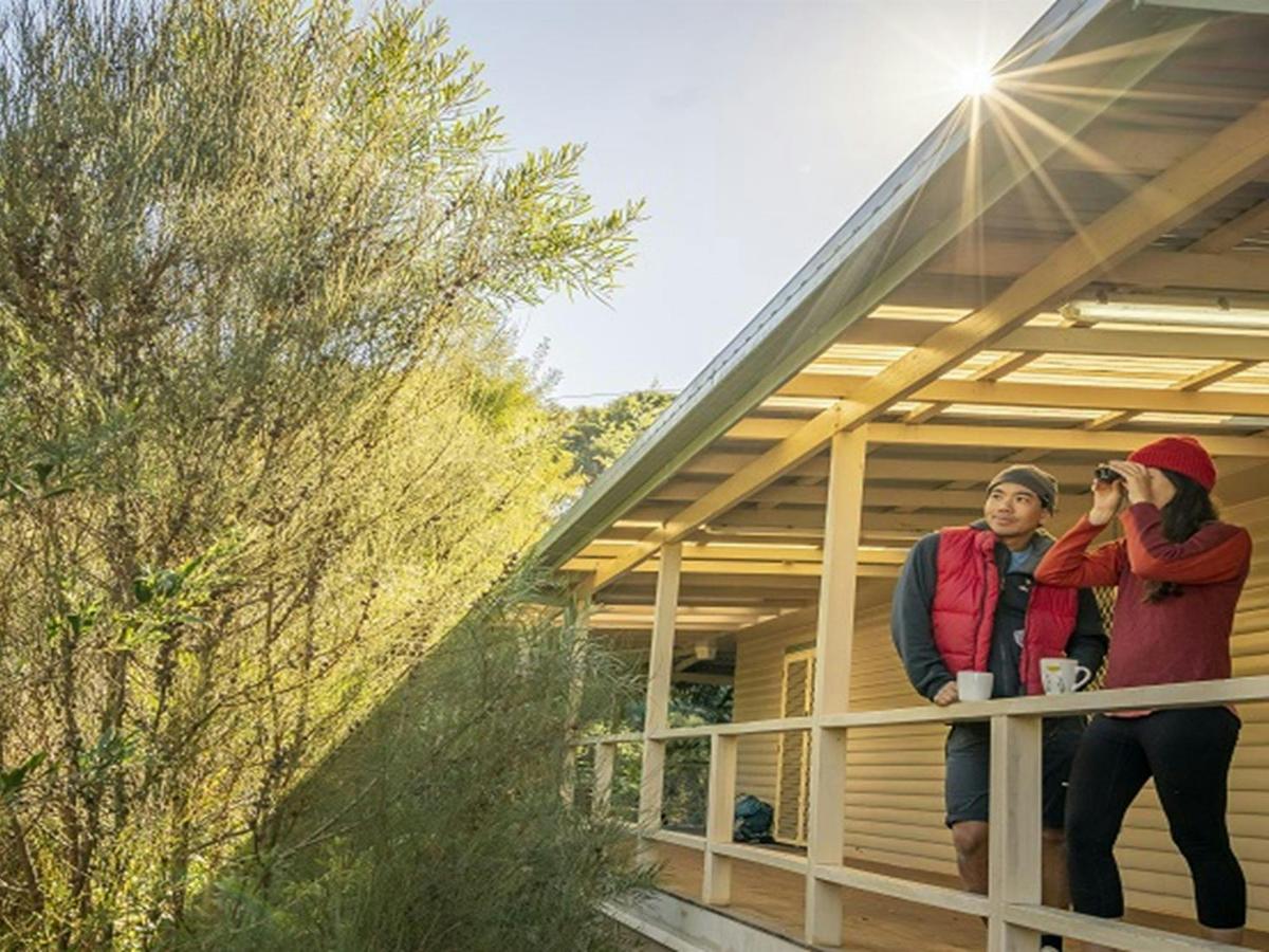 Visitors looking out from the deck at Gibralter House. Photo: John Spencer/OEH