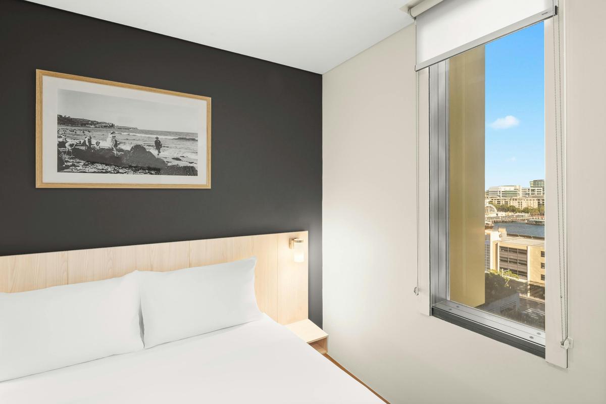 Superior King Room with Darling Harbour views, featuring the signature ibis Sweet Bed